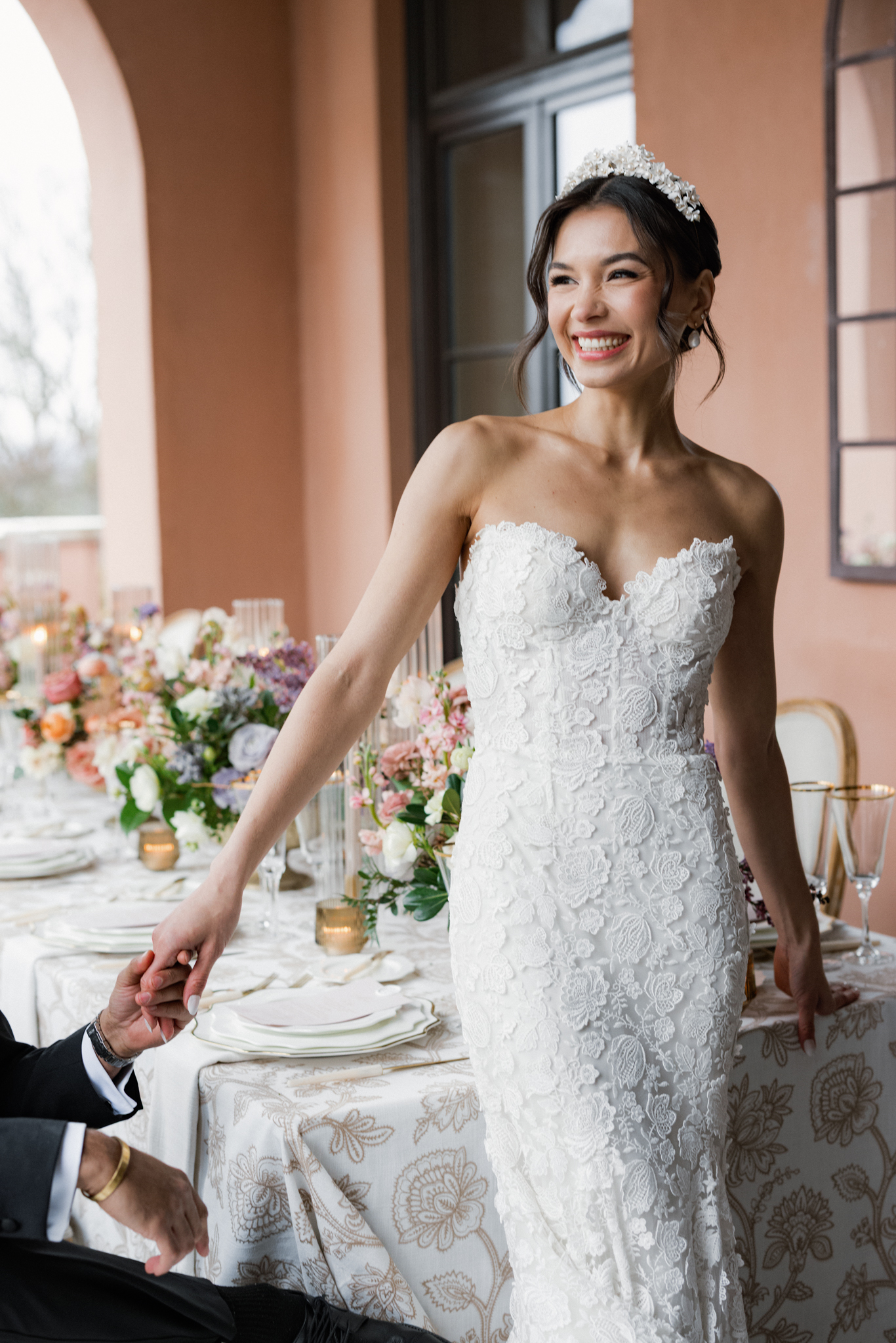 bride laughing at reception table during destionation wedding weekend